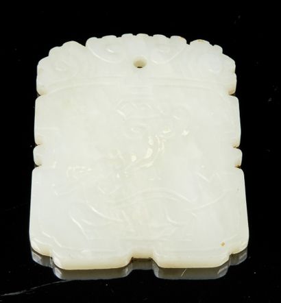 CHINE, XXe siècle White jade pendant with incised decoration on both sides of a qilin...