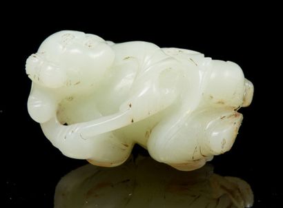 CHINE, fin XIXe siècle Small white celadon jade subject representing a child holding...