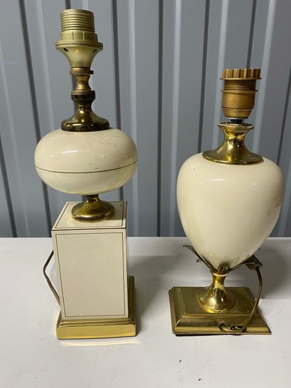 null Two table lamps with cream ceramic base and gilded metal mount.

French work...