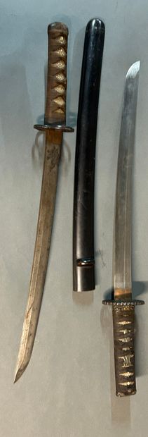 null Japanese sword called Wakisashi.

Made from a blade of

shortened katana blade.

Fuchi...