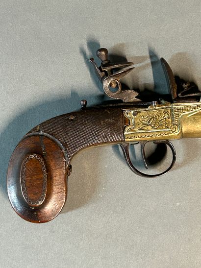 null Small flintlock marine pistol.

Flat-bodied hammer, chased bronze case with...