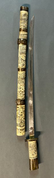 null Small Wakisachi sword.

Straight steel blade.

Mounted in chased bone with samurai...