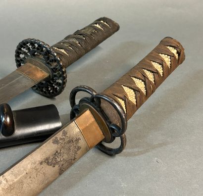 null Japanese sword called Wakisashi.

Made from a blade of

shortened katana blade.

Fuchi...