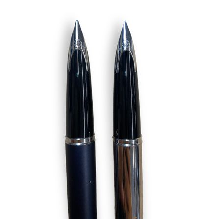 null WATERMAN 
ensemble de deux stylos plumes, un gris et métal et un autre tout...