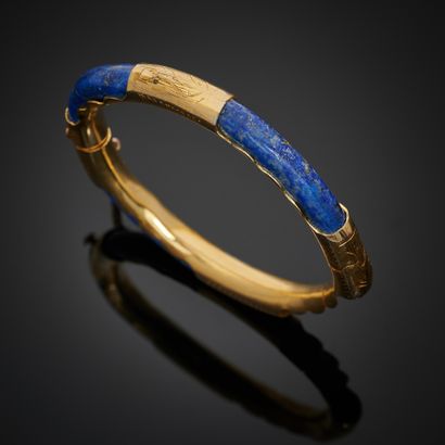 null * BRACELET jonc rigide ouvrant en vermeil 925 mm, orné de quatre motifs de lapis-lazuli...