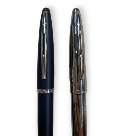null WATERMAN 
ensemble de deux stylos plumes, un gris et métal et un autre tout...