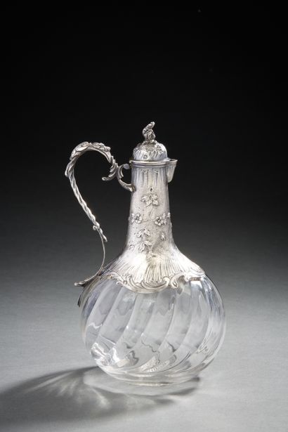 null Crystal decanter with liquor, the silver setting with decoration of garlands...