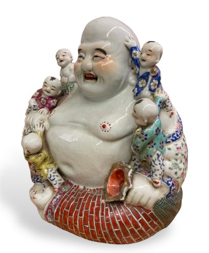 null CHINA
Porcelain group representing a seated Buddha surrounded by five children.
Modern...