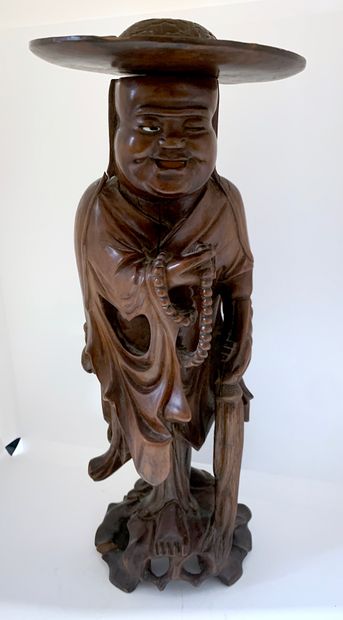 null CHINE
Figurine en bois sculpté représentant un bouddha tenant dans sa main un...