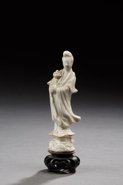 null CHINA
White enameled porcelain figurine representing the goddess Guanyin.
H....