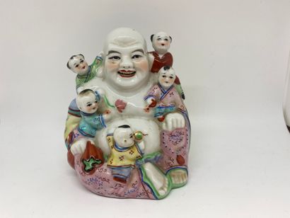 null CHINA
Porcelain group featuring a Buddha surrounded by five children treated...