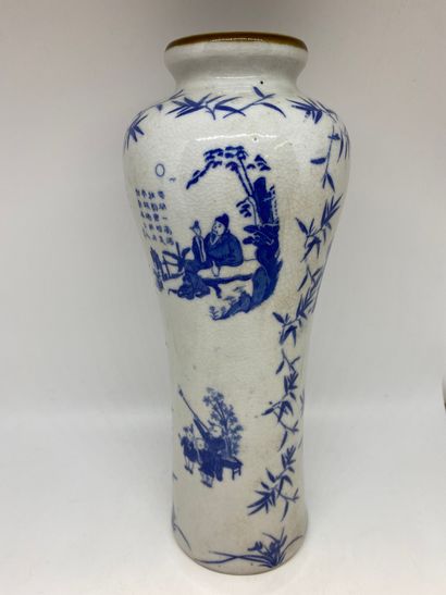null CHINA
Porcelain vase with printed decoration of characters and bamboos.
H. 28.5...