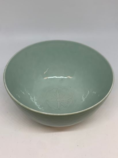 null CHINA
Porcelain bowl decorated in incision with celadon glaze. 
Mark on the...