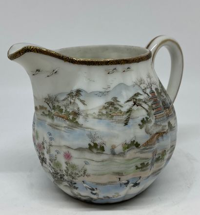 null JAPAN 
Part of a tea service in grodroned porcelain decorated with a lake landscape,...
