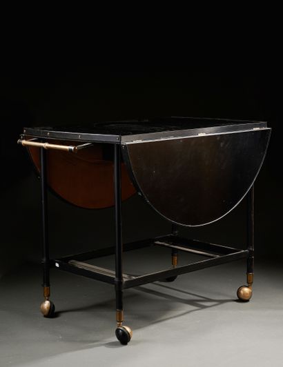 null Jacques ADNET (1901-1984)

Rare table roulante " à système " à structure en...