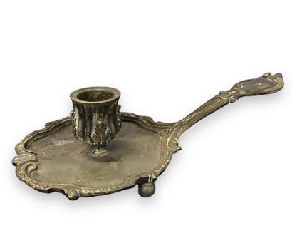 null HAND CANDLESTICK 
in silver-plated metal, Rocaille style.
18th century ?
Dim.:...