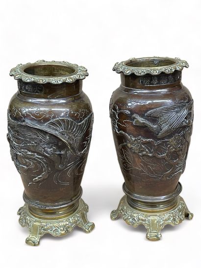 null JAPAN
Two bronze vases decorated with birds with gilt bronze mounts. 
Inscription...