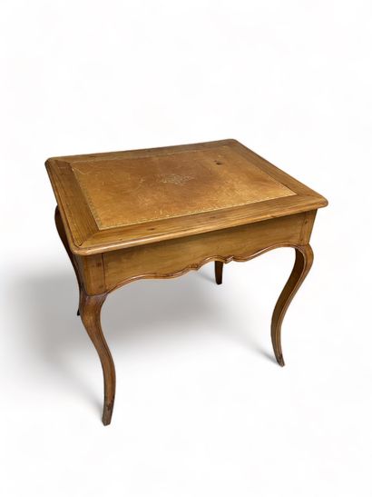 null Rectangular table with leather top, opens with a drawer in the waist and rests...