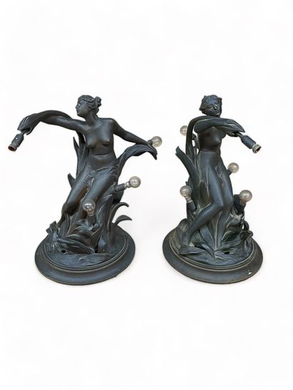 null Pair of brown patina bronze TABLE LAMPS featuring a nude woman with a modesty...