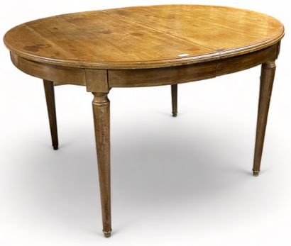 null Oval-shaped dining table with four legs and two folding central legs.
Louis-Philippe...