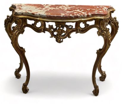 null An openwork giltwood console with rocailles motifs and a recessed top of red...