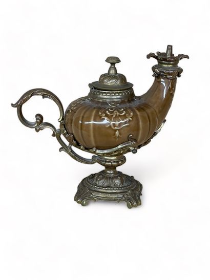 null CHINA
Earthenware oil lamp with brown glaze. Chased bronze frame. 
Late 19th...