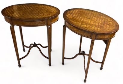 null Pair of oval pedestal tables in cube marquetry.
English work circa 1900.
H:...
