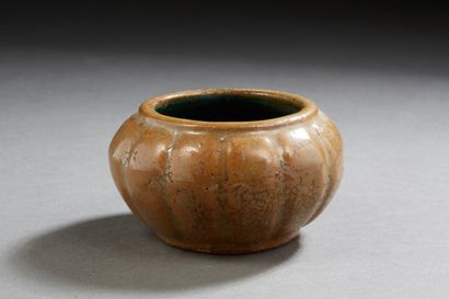 null China circa 1900
A beige-glazed ceramic bucket in the shape of a lotus bud,...
