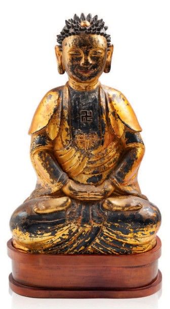 null Bouddha en bois sculpté, patiné et doré.
Travail coréen fin XIXe.
H.: 63 cm