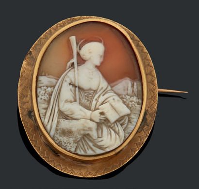 null Camé représentant Sainte Agnès, monture en métal. XIXe siècle.
Dim.: Haut.:...