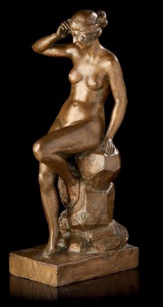 L. MALSERT Femme nue assise sur un rocher.
Epreuve en bronze à patine brune signée...