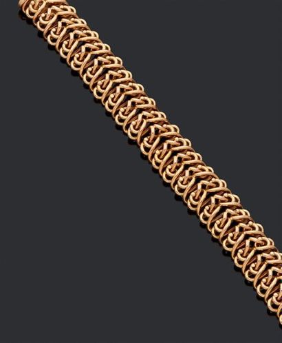 null Bracelet ruban en or jaune 18K (750) à maille double perlée.
Larg.: env. 19,5...