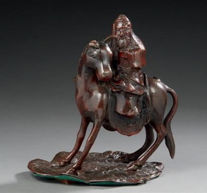 JAPON (?) 
Sujet en bronze figurant un cavalier sur sa monture.
Travail moderne.
H.:19...