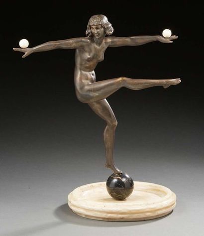 Marcel-André BOURAINE (1886-1948) Sculpture en bronze et ivoire à patine brune figurant...