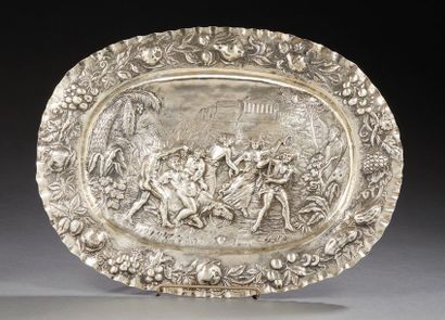 null repoussé silver dish decorated with bachanales in a finely engraved antique...