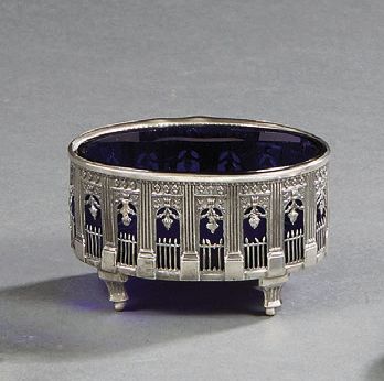 null Oval silver saleron, with an openwork gallery, resting on four pilaster feet....