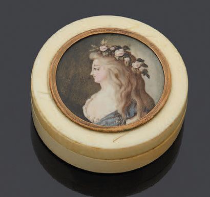 null Round ivory box with a lid decorated with a miniature on ivory depicting a woman's...