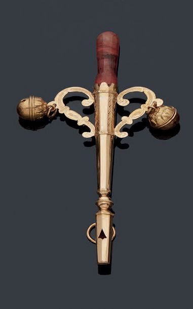 null Gold whistling rattle, body with sides holding two consoles and their bells...