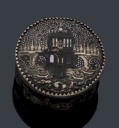 null Round box with a gadrooned body in flake and silver inlay. The architecturally...