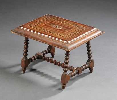 null Turned wooden doll table; the top with Moorish inlaid decoration.
19th century.
H:...