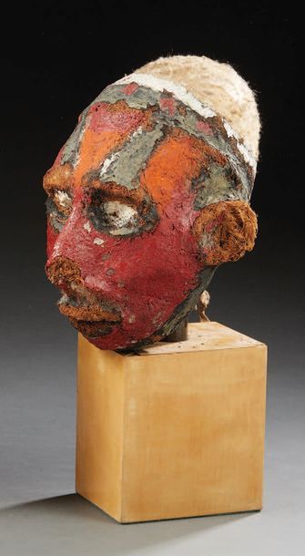 null Overmodelled skull covered with a vegetable coating painted red and black and...