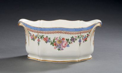 SÈVRES Oval bowl in soft porcelain with handles in the shape of a scroll decorated...