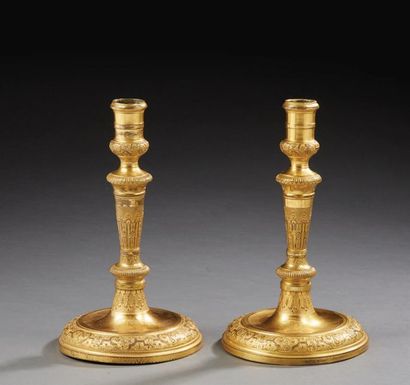null Pair of gilded bronze candleholders with "à la Bérain" decoration finely carved...