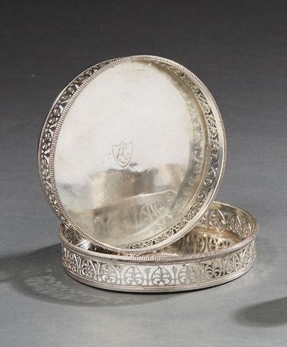 null Pair of round silver coasters, bordered by a gallery pierced with a frieze of...
