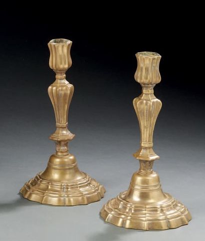 null Pair of silver bronze candleholders (worn); bobèches and channel drums; moulded...