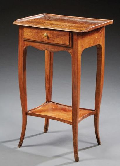 null Small walnut table; the rectangular top decorated with "Eastern" nets; it opens...