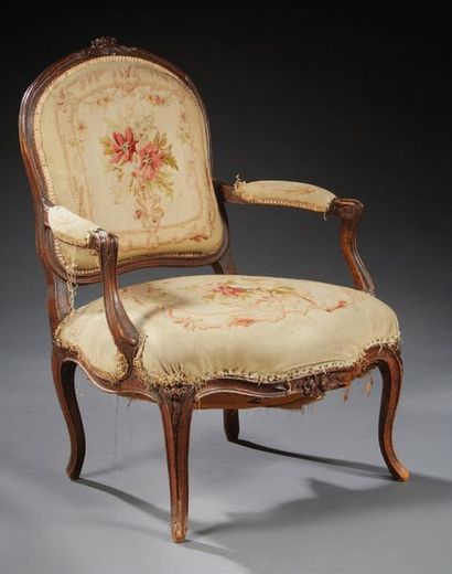 null Armchair with flat backrest in beech moulded and carved with stylized flowers...