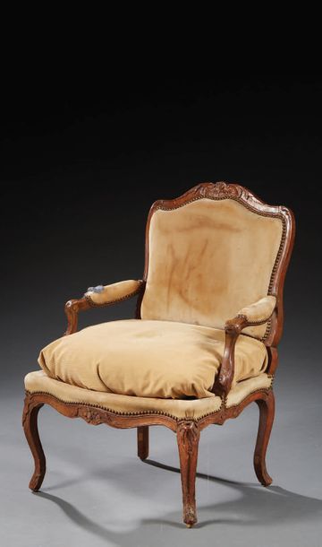 null Armchair with a flat backrest in beech moulded and carved with stylized flowers...