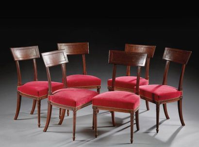 null Set of six mahogany chairs molded and sculpted; trapezoidal headband backs;...