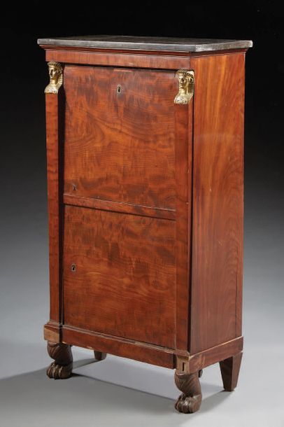 null Secretary in mahogany and mahogany veneer; rectangular in shape, it opens with...